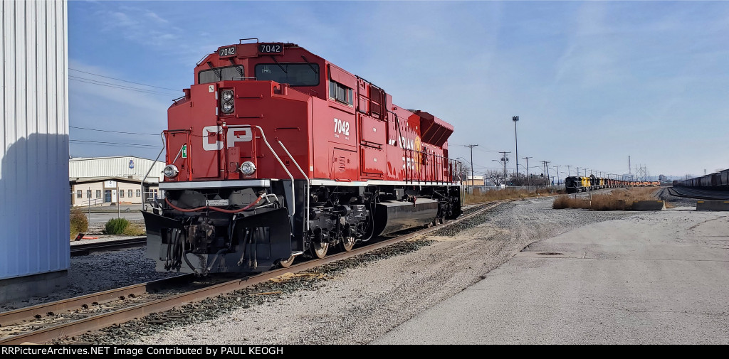 CP 7042 as The Morning Sun Reflects Of Her Canadian Pacific Beaver Tail Paint Job!! .